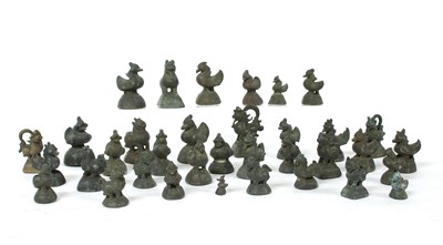 Lot 890 - A collection of Burmese bronze opium weights
