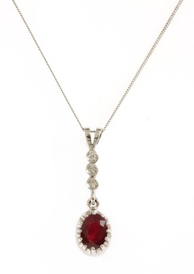 Lot 244 - An 18ct white gold ruby and diamond pendant