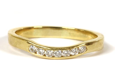Lot 202 - An 18ct gold shaped diamond half eternity ring