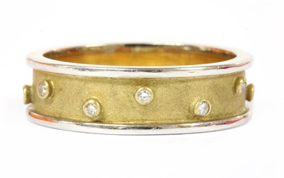 Lot 177 - An 18ct two colour gold diamond set band ring