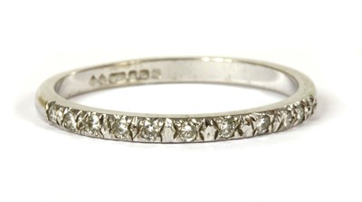 Lot 135 - An 18ct white gold diamond half eternity ring