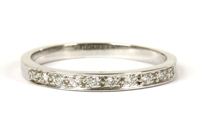 Lot 131 - An 18ct white gold diamond half eternity ring