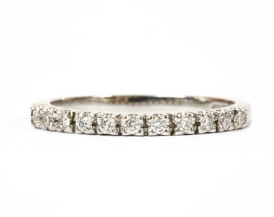 Lot 231 - An 18ct white gold diamond half eternity ring