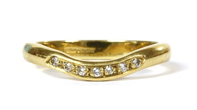 Lot 180 - An 18ct gold diamond set shaped wedding ring