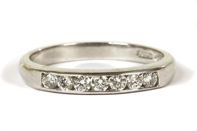 Lot 130 - An 18ct white gold diamond half eternity ring