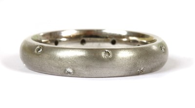 Lot 125 - An 18ct white gold diamond set satin finish wedding ring