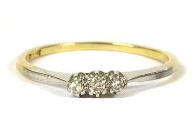 Lot 186 - A two colour gold three stone diamond ring