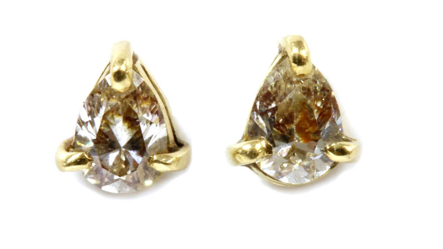 Lot 223 - A pair of gold single stone diamond stud earrings