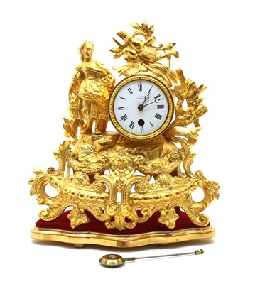 Lot 338 - A late 19th century French gilt cased mantle timepiece