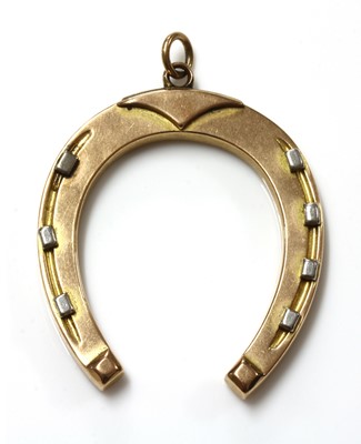 Lot 490 - An Edwardian gold horseshoe fob or pendant