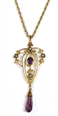 Lot 42 - An Edwardian gold amethyst and split pearl pendant