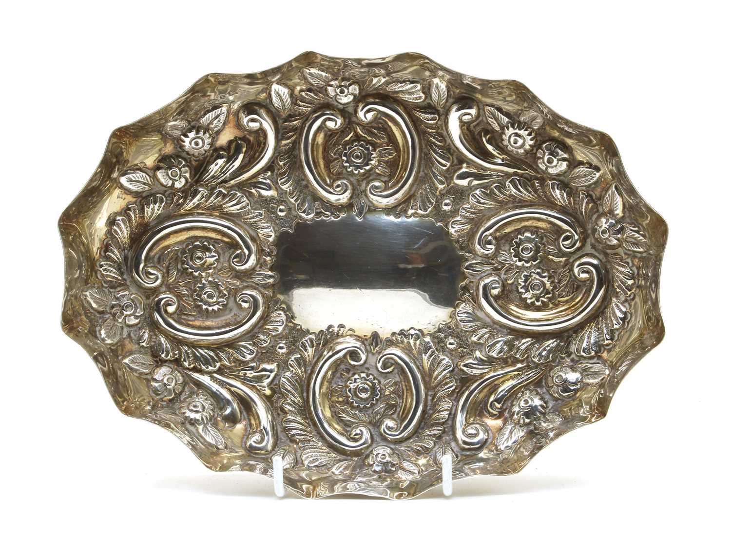 Lot 4 - A late Victorian embossed silver tray