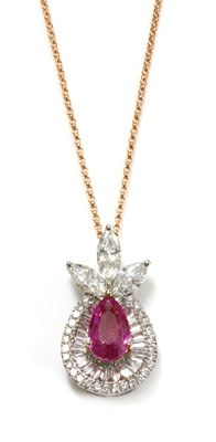 Lot 444 - A white and rose gold pink sapphire and diamond pendant