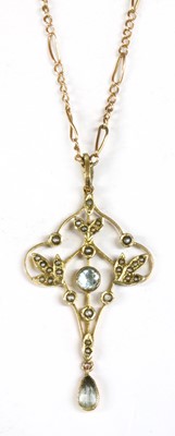 Lot 41 - An Edwardian gold aquamarine and split pearl pendant