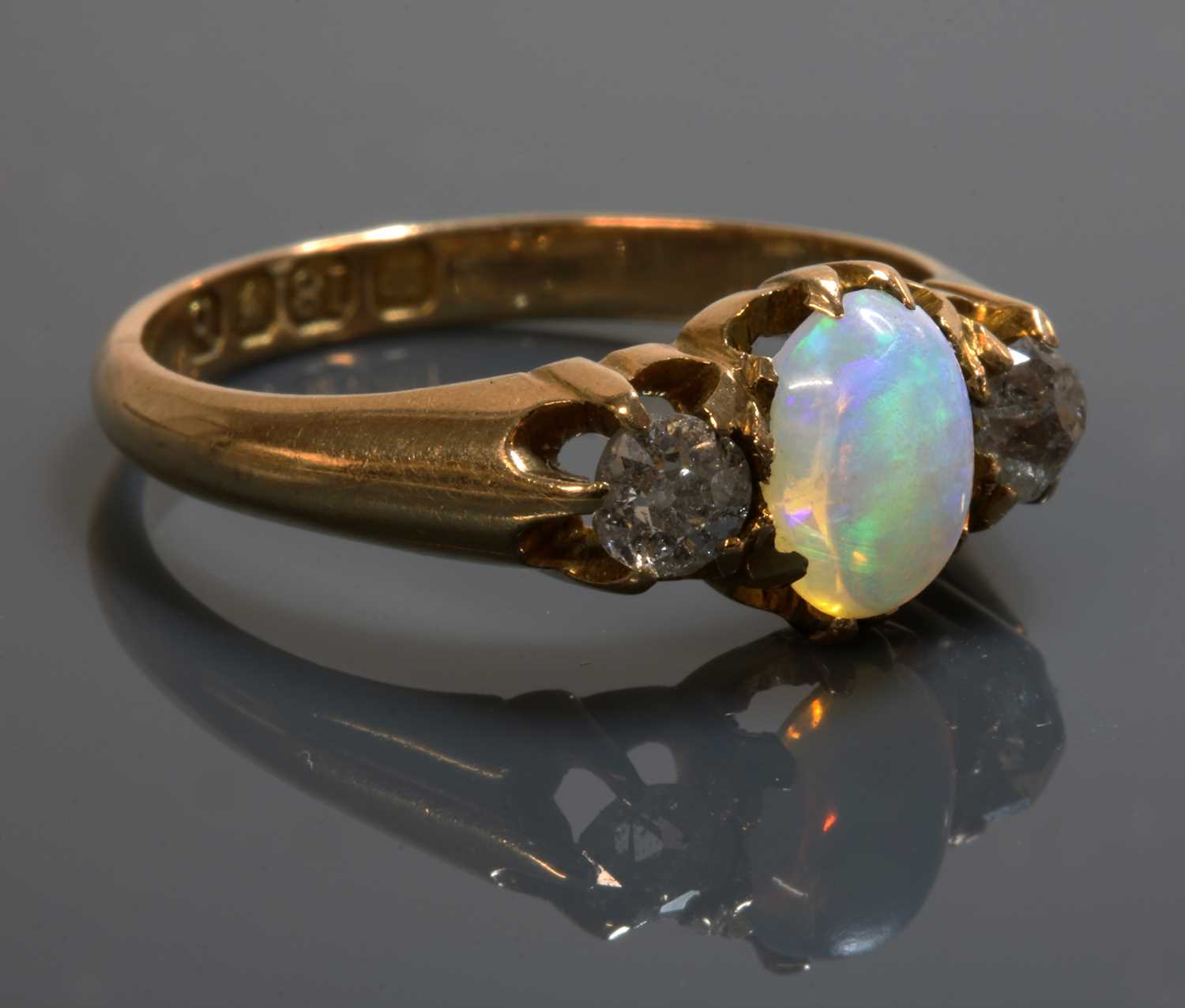 Lot 107 - An 18ct gold late Victorian three stone opal and diamond ring