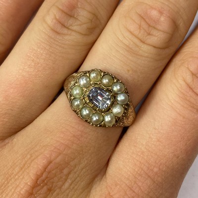 Lot 28 - A white sapphire and split pearl cluster ring