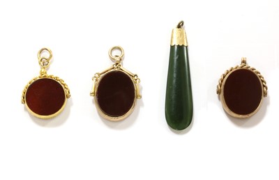 Lot 402 - Three 9ct gold bloodstone and cornelian swivel fobs