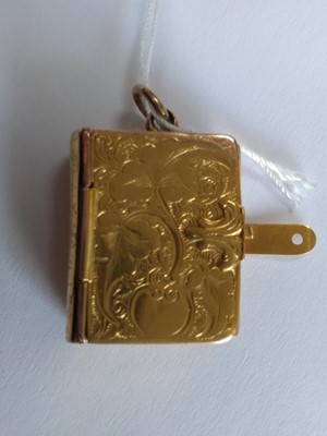 Lot 62 - A Victorian rectangular hinged locket of book form