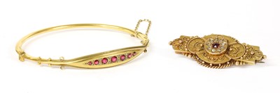 Lot 62 - A 15ct gold ruby and diamond brooch