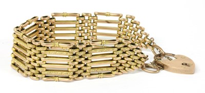 Lot 303 - A gold six row gate bracelet
