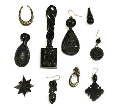 Lot 82 - A quantity of carved jet jewellery