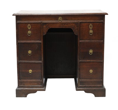 Lot 377 - An oak kneehole desk