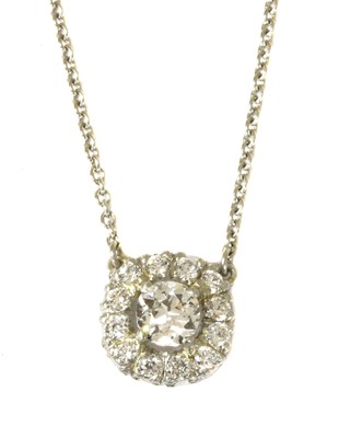 Lot 112 - A platinum diamond cluster pendant