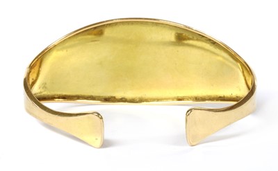 Lot 19 - A gold gem-set torque bangle