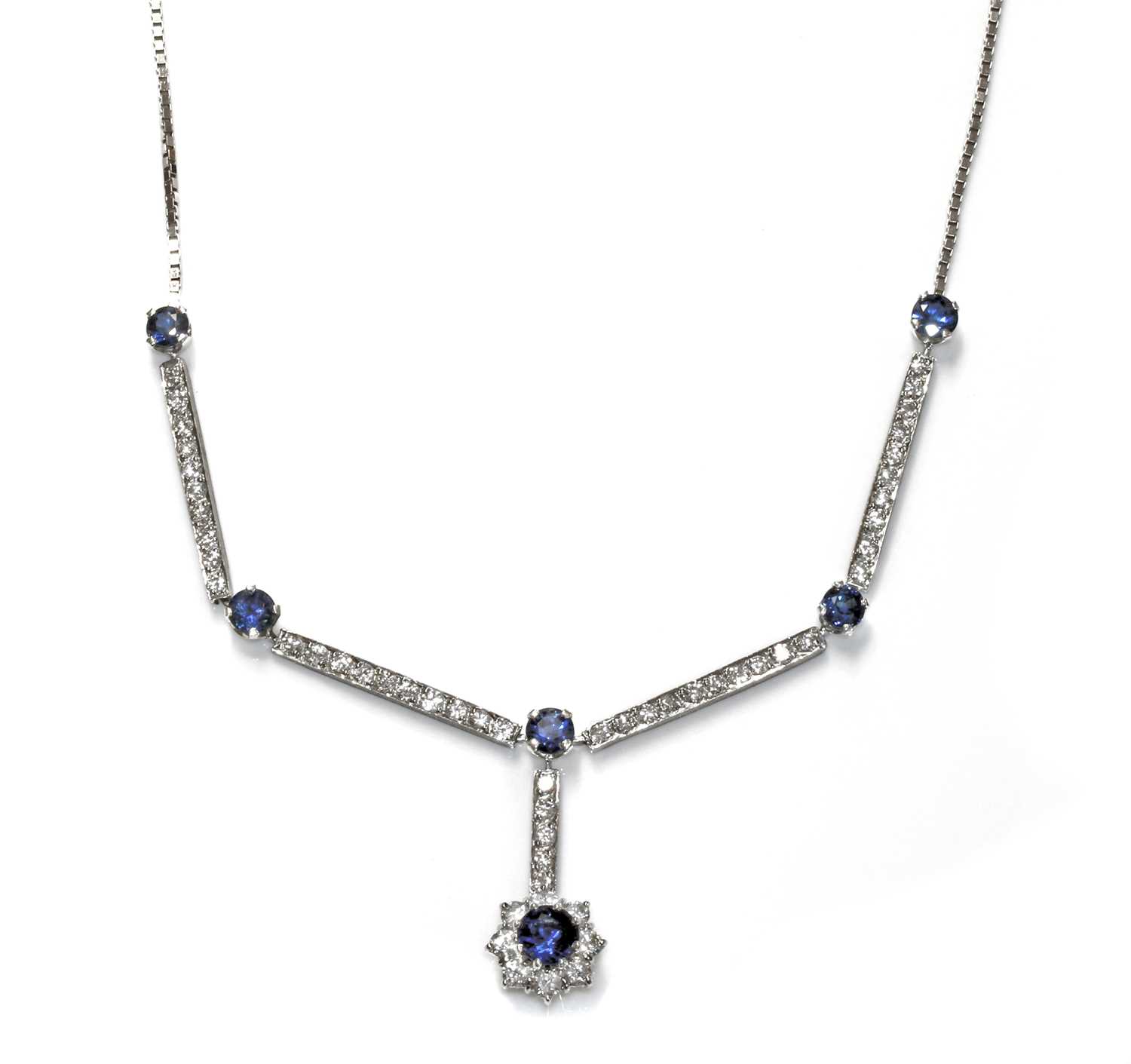 Lot 454 - An 18ct white gold sapphire and diamond cluster necklace, c.1970