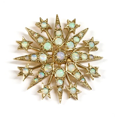 Lot 261 - A 9ct gold opal star pendant
