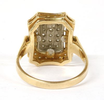 Lot 1182 - A two colour gold pavé diamond ring