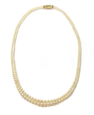 Lot 122 - A cased two row graduated natural pearl necklace