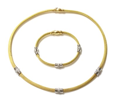 Lot 319 - An 18ct yellow and white gold diamond set necklace and bracelet suite, by Italian Lynx