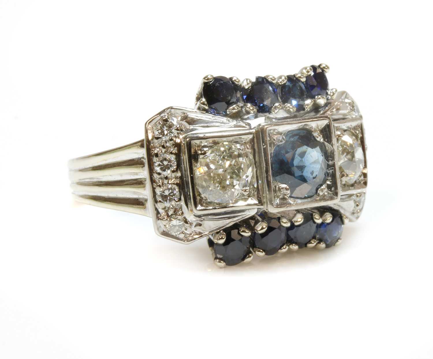 Lot 188 - A Continental sapphire and diamond bow ring, c.1940