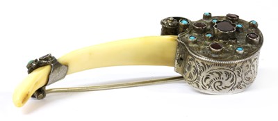 Lot 55 - A silver mounted tusk brooch