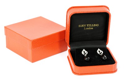 Lot 377 - A pair of 18ct white gold diamond and onyx set drop earrings, by Susy Telling