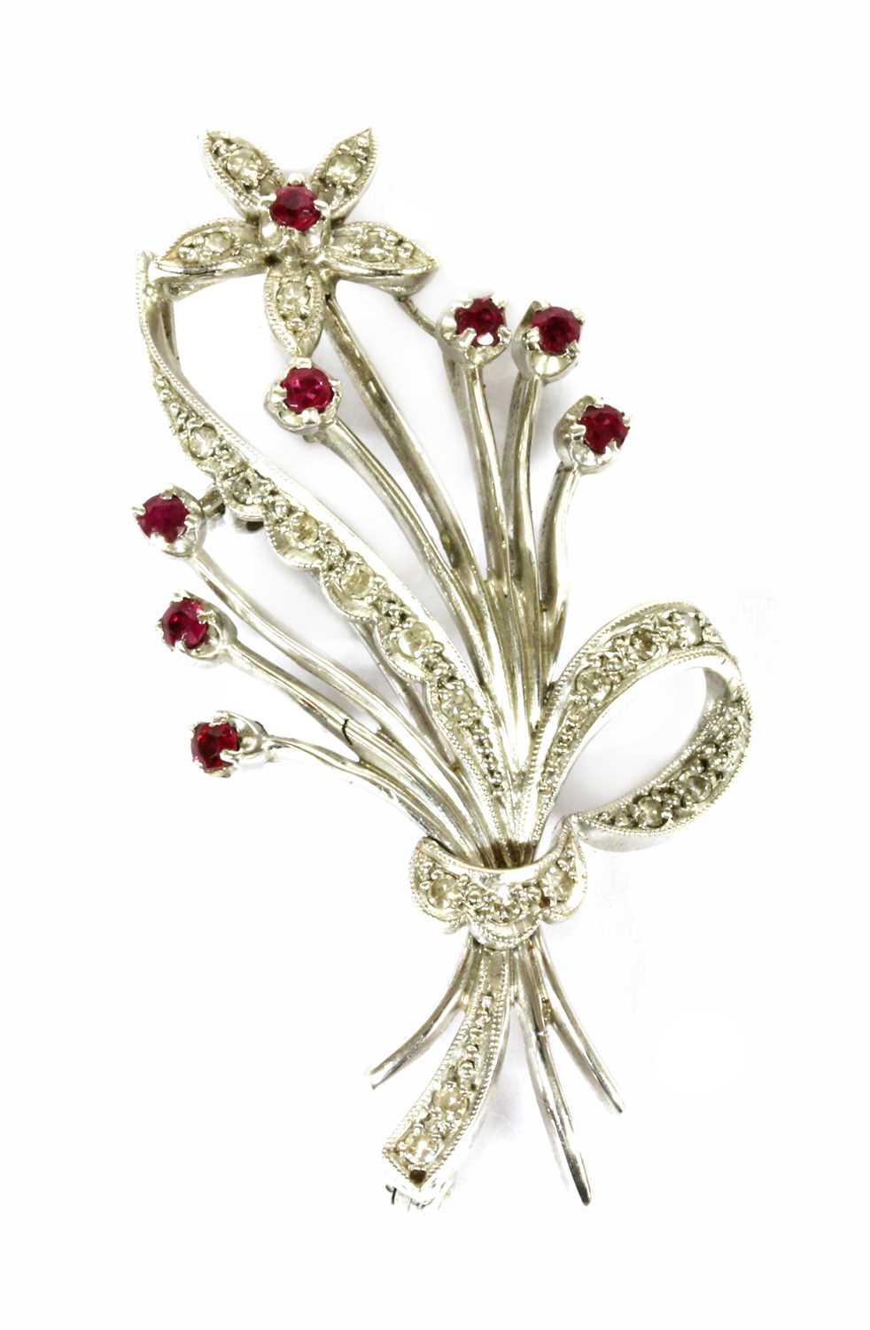 Lot 50 - An 18ct white gold ruby and diamond floral spray brooch, c.1960