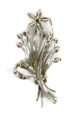 Lot 50 - An 18ct white gold ruby and diamond floral spray brooch, c.1960