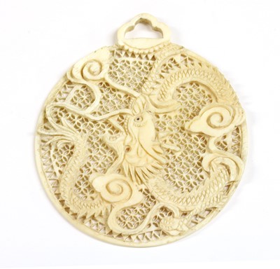 Lot 79 - A carved pierced ivory pendant