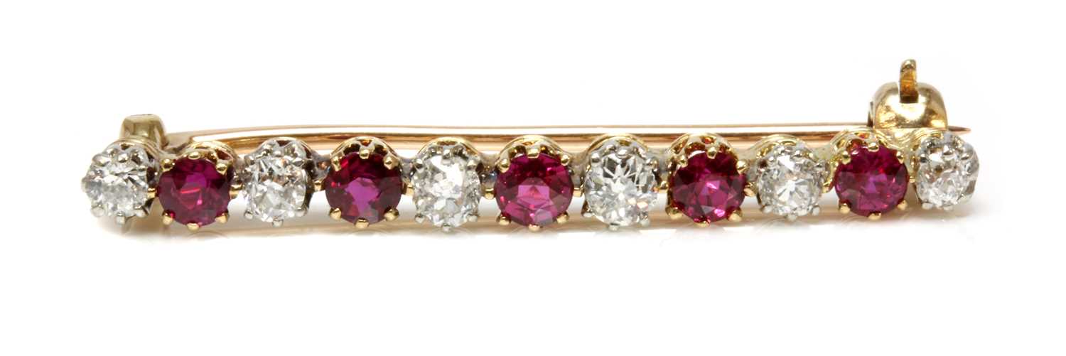 Lot 36 - A ruby and diamond two colour bar brooch