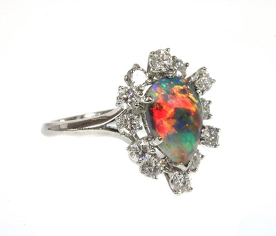 Lot 103 - A black opal and diamond pear-shaped cluster ring