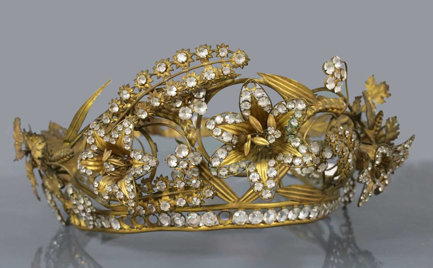 Lot 9 - A Regency gilt metal and paste, en tremblant tiara or headdress, c.1810-1830