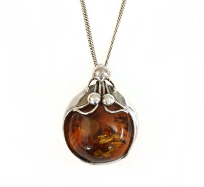Lot 234 - A sterling silver amber pendant