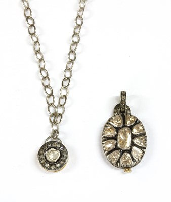 Lot 162 - A silver and gold foil-backed diamond pendant