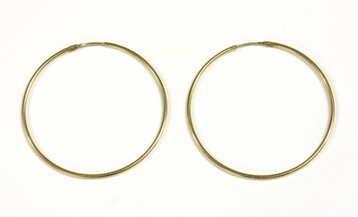 Lot 291 - A pair of gold hollow hoop earrings