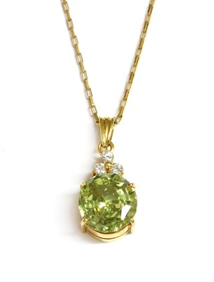Lot 298 - A gold sphene and cubic zirconia pendant