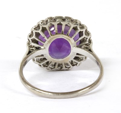 Lot 100 - A platinum amethyst and diamond cluster ring