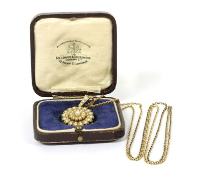 Lot 38 - An Edwardian gold split pearl brooch/pendant