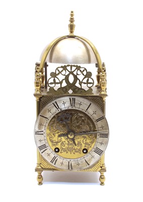 Lot 140 - A brass 'lantern' clock