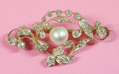 Lot 26 - A late Victorian pearl and diamond scrolling brooch